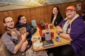 Attendees at Twede's Cafe for Wisteria Lodge show