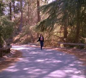 Donna Walking on Wooded Road